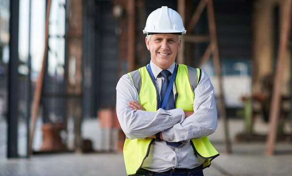 Portrait of senior engineer man at a construction site outdoor for building project management. Face of happy contractor person with helmet for civil engineering, safety and development with vision