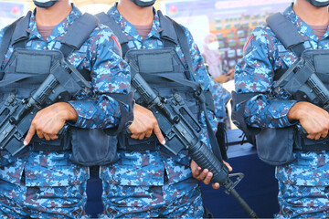 close up A unit of military commandos in uniforms carrying SK guns as their personal weapons is...