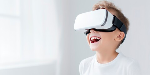 Portrait of happy little boy wearing virtual reality glasses isolated on white background with copy space. Banner template of smiling boy in white VR goggle - obrazy, fototapety, plakaty