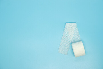 elastic gauze bandage on blue background