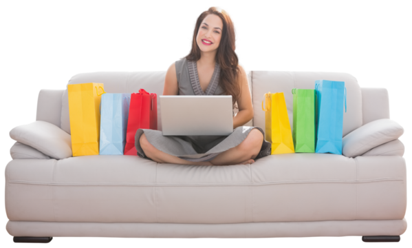 Digital png photo of happy caucasian woman with colourful bags and laptop on transparent background - Powered by Adobe