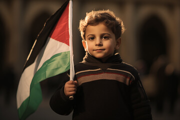 Palestine kid or child holding palestine flag at al aqsa mosque with free palestinian flag aqsa mosque protect concept.
