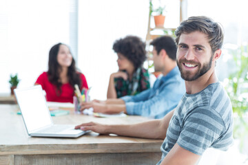 Digital png photo of smiling caucasian businessman in office on transparent background