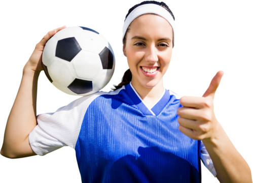 Digital png photo of smiling caucasian female football player with ball on transparent background - Powered by Adobe