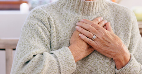 Hands, breathing and heart attack with an elderly person in the dining room of a retirement home closeup. Healthcare, medical or emergency and a senior adult with chest pain for cardiac arrest
