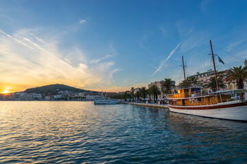 Fototapeta premium Riva promenade at sunset in Split overlooking Marjan park, Croatia