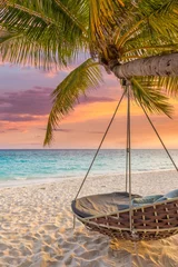 Poster Beautiful tropical Maldives beach under cloudy sunset sky. romantic swing hanging on coconut palm. Luxury vacation travel. Inspiration honeymoon mood, calm couple beach background. Amazing landscape © icemanphotos