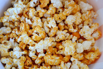 Striped box with popcorn on red background