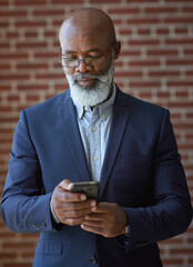 Startup, black man and manager with smartphone, online reading and connection for typing. Mature male, African American employee or leader search internet, success or small business with entrepreneur - obrazy, fototapety, plakaty