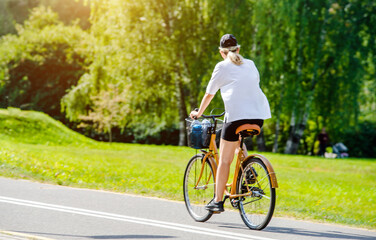 Cyclist ride on the bike path in the city Park
