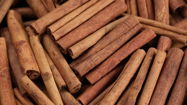 Zoom frame cinnamon sticks, rotate. Fragrant cinnamon close-up. Spices with cinnamon