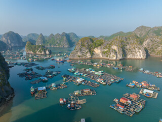Floating fishing village in Lan Ha Bay, Vietnam viewed from above. Famous tourist destination in the north of Vietnam © Hanoi Photography