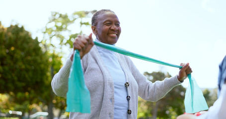 Elderly, woman and physiotherapy for fitness with resistance band in park, outside or garden for wellness. Black person, smile and happy with results in mobility, recovery or rehabilitation of injury
