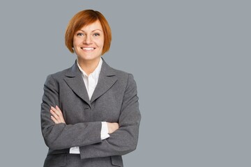 Happy young confident business woman posing