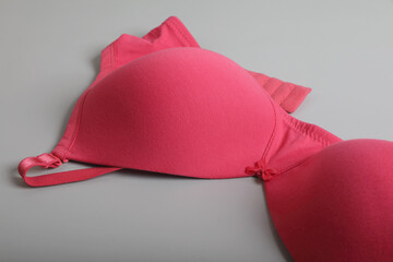 Women's padded bra isolated on gray background	
