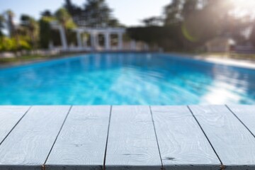 Empty blank table top on swimming pool background