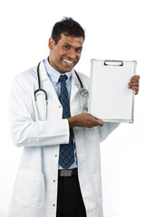 Happy Indian male doctor showing a clipboard.