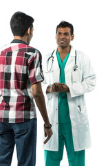 Indian Doctor talking a patient.