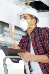 Fototapeta na wymiar builder male worker in protective mask