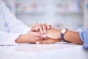 Cercles muraux Vielles portes Woman, pharmacist and holding hands for healthcare, support or trust on counter at the pharmacy. Closeup of female person or medical professional with patient in care for consultation, help or advice