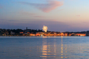 Fototapeta premium The old town of Rovinj with the church of St. Euphemia seen from the sea on a sunny day with blue sky