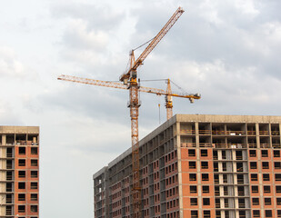 Tower crane at the construction site of a multi-story building