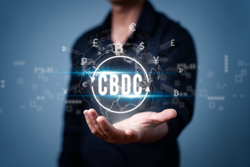 Businessman holding virtual hologram of earth and CBDC text, Central Bank Digital Currency. Money transfer, money transaction, global currency network, stock exchange business concepts
