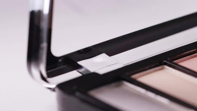 Set of cosmetics powder eye shadows with different shades, close-up. Design, macro, slider
