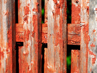 an old wooden fence that has been red