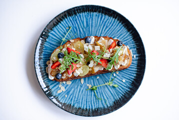 Sweet Panini with Strawberries and Grapes on White Background
