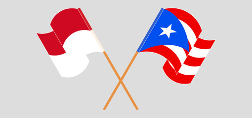 Crossed and waving flags of Monaco and Puerto Rico