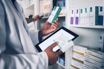 Poster Pharmacist, tablet and hands for inventory inspection, box or medication on shelf at the pharmacy. Man, medical or healthcare professional checking stock, pills or medicine for storage at drugstore © Azeemud/peopleimages.com