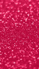 Viva Magenta lights bokeh background, Chrismas lights bokeh. Viva Magenta abstract background. Blurred and glowing lights. Viva Magenta bokeh lens effect from lighting spots.