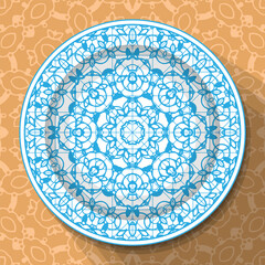 A white plate with an openwork blue ornament, located on a light brown patterned tablecloth. Pattern No. 2. Vector illustration