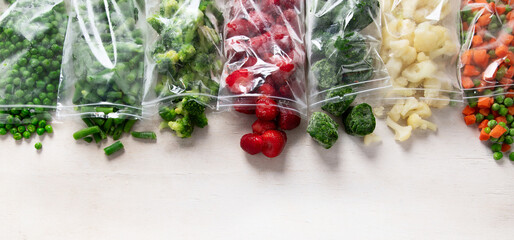 Frozen vegetable and berry fruit mix in plastic bags.