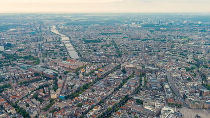 Amsterdam, Netherlands. Panorama of the city in the morning in cloudy weather. View of the Amstel...