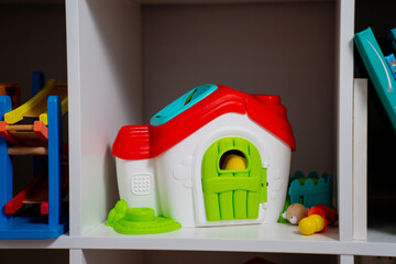 Toy house in the shelve of children play room