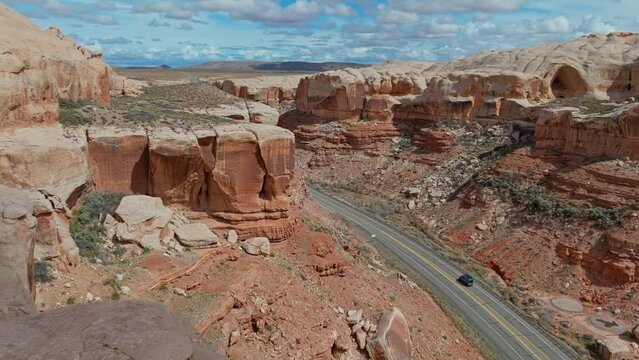 Driving On The Road With Incredible Nature Sights At The Arches National Park In Utah, United States. Aerial Drone Shot