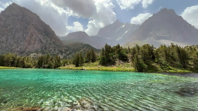 The Alaudin (Chapdara) lakes, lying at an altitude of 2800 m, are considered one of the most beautiful lakes of the Fan Mountains. Turquoise mountain lake. Pamiro-Alai. Tajikistan, Pamir 4K