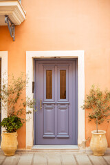 Fototapeta na wymiar A purple door of a house in Preveza, Greece