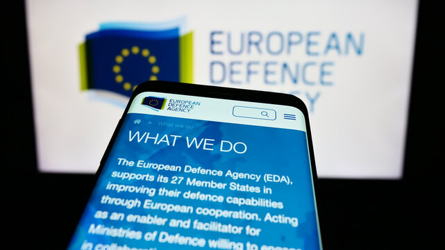 Stuttgart, Germany - 10-17-2023: Smartphone with website of EU institution European Defence Agency (EDA) in front of logo. Focus on top-left of phone display.