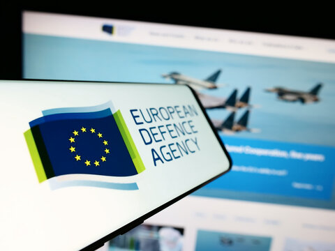 Stuttgart, Germany - 10-17-2023: Mobile phone with logo of EU institution European Defence Agency (EDA) in front of website. Focus on center-left of phone display.