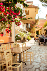 Fototapeta na wymiar A cute street with cafes and taverns in Preveza, Greece