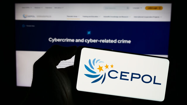 Stuttgart, Germany - 10-17-2023: Person holding cellphone with logo of European Union Agency for Law Enforcement Training (CEPOL) in front of webpage. Focus on phone display.