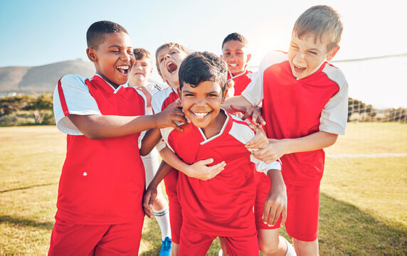 Soccer, winner or happy team of children for success, goal or celebration in game or competition on soccer field. Football, sport boy or athlete kids in training workout, teamwork exercise or support