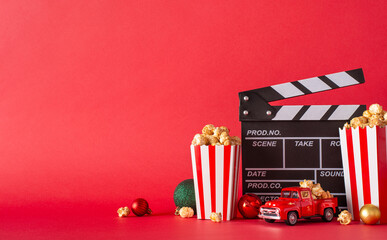 Cozy up at home this Christmas Eve with our popcorn delivery idea. Side view shot of table adorned...