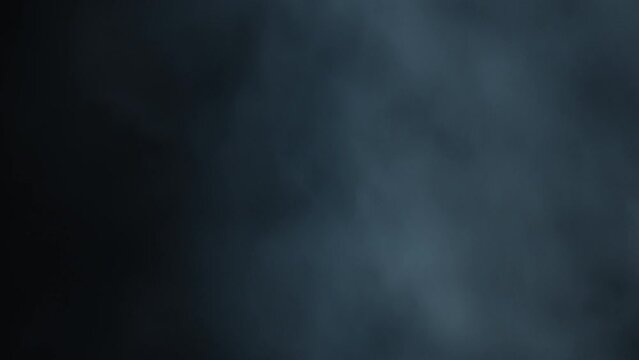 Abstract VFX fog cloud element. Smoke in slow motion on black Smoke and fog effect. Cloud chamber. The cinematic slow-motion atmosphere. Layered VFX thunder strobe light element. Smoke machine.