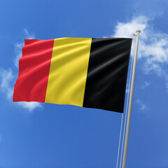 Belgium flag fluttering in the wind on sky.