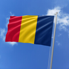 Chad flag fluttering in the wind on sky.