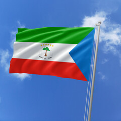 Equatorial Guinea flag fluttering in the wind on sky.